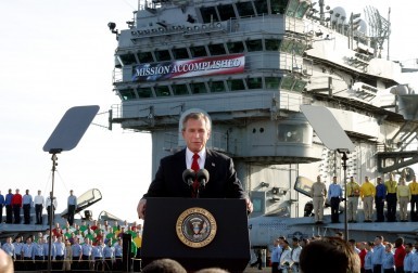 ** FILE ** President Bush declares the end of major combat in Iraq as he speaks aboard the aircraft carrier USS Abraham Lincoln off the California coast, in this May 1, 2003 file photo. Democratic congressional leaders on Tuesday, May 1, 2007 sent Iraq legislation setting timetables for U.S. troop withdrawals to President George W. Bush and a certain veto. On the fourth anniversary of the president's "Mission Accomplished" speech, Senate Majority Democratic Leader Harry Reid said that Bush "has put our troops in the middle of a civil war. A change of course is needed." (AP Photo/J. Scott Applewhite)